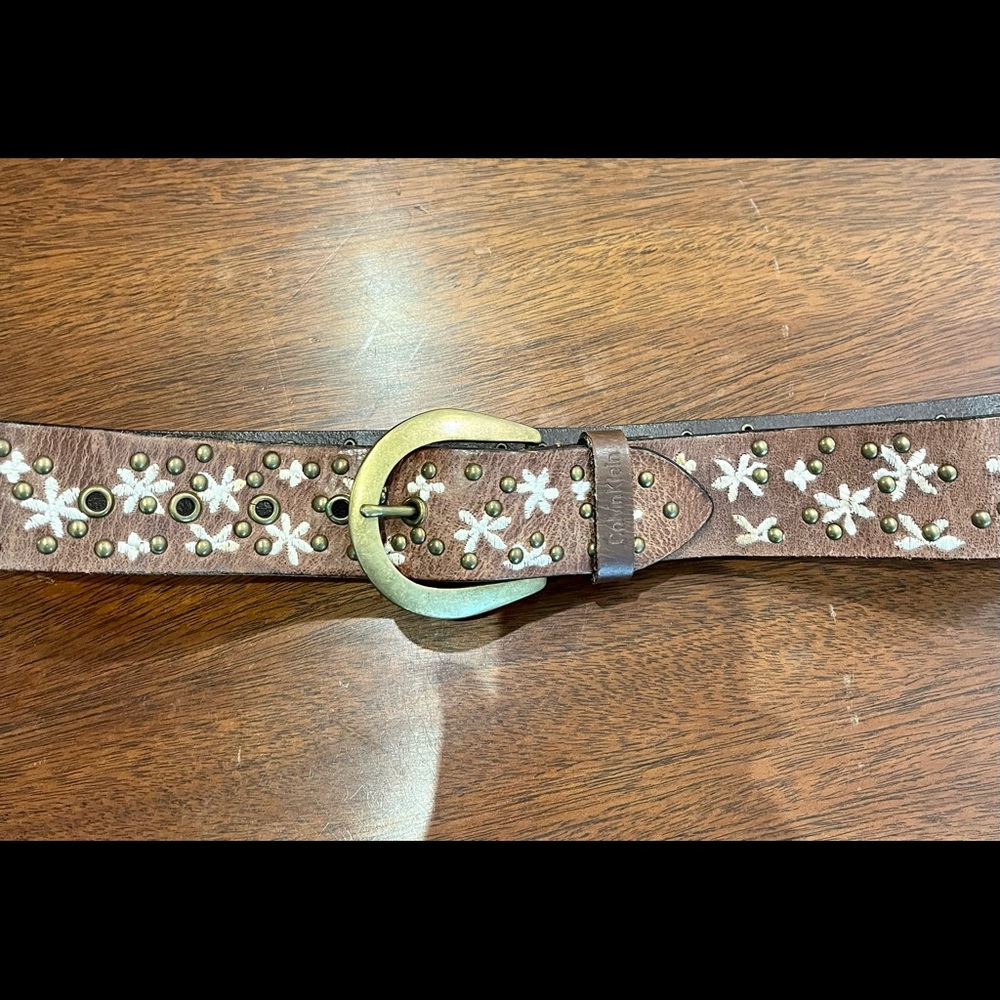 Calvin Klein gently used brown leather belt with studs & embroidery.